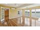 Large bedroom featuring hardwood floors, multiple windows with views and a doorway leading to another room at 1144 Clearspring Dr, Charleston, SC 29412