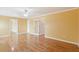 Open bedroom design with gleaming hardwood floors and access to other rooms via open doorways at 1144 Clearspring Dr, Charleston, SC 29412