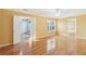 Spacious bedroom with hardwood floors, ceiling fan, and a view to other rooms through open doorways and windows at 1144 Clearspring Dr, Charleston, SC 29412
