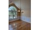 Elegant dining area featuring a modern chandelier, chair rail, and natural light at 1144 Clearspring Dr, Charleston, SC 29412