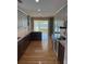 Spacious, well-lit kitchen featuring hardwood floors and access to the outdoor views at 1144 Clearspring Dr, Charleston, SC 29412