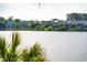 Scenic lake view showcasing waterfront homes, with solar panels on many roofs at 1144 Clearspring Dr, Charleston, SC 29412