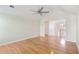 Open living room boasts vaulted ceiling with fan, hardwood floors, and views to the entry and stairway at 1144 Clearspring Dr, Charleston, SC 29412