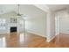 Bright living room featuring a fireplace, large windows, and an adjoining hallway for convenient access to other rooms at 1144 Clearspring Dr, Charleston, SC 29412