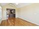 Bright living room featuring hardwood floors, mini-split air conditioner, and connection to the kitchen area at 1144 Clearspring Dr, Charleston, SC 29412
