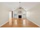 Open living room offers a fireplace, vaulted ceiling with fan, and hardwood floors at 1144 Clearspring Dr, Charleston, SC 29412