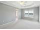 Bright main bedroom with large windows offering scenic water views at 1144 Clearspring Dr, Charleston, SC 29412