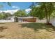 Backyard view featuring red furniture and a firepit in the yard at 1172 Dawn Dr, Charleston, SC 29412
