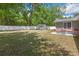 Large backyard includes patio furniture, a firepit, and lots of grass at 1172 Dawn Dr, Charleston, SC 29412