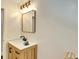 The bathroom features a light wood vanity with a rectangular mirror above it at 1172 Dawn Dr, Charleston, SC 29412