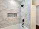 A modern bathroom featuring white marble tile, a large shower head, and a built in niche at 1172 Dawn Dr, Charleston, SC 29412