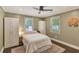 This bedroom features a ceiling fan, two windows and has an accent rug on the floor at 1172 Dawn Dr, Charleston, SC 29412
