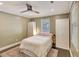 This bedroom features a ceiling fan and two windows. It also has an accent rug on the floor at 1172 Dawn Dr, Charleston, SC 29412
