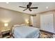 This bedroom has a ceiling fan, two side tables, and access to the restroom at 1172 Dawn Dr, Charleston, SC 29412