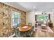 Charming dining area with unique wallpaper and views of the living room, creating a cozy and stylish space at 1172 Dawn Dr, Charleston, SC 29412