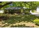 Charming brick home nestled on a verdant lawn, surrounded by mature trees and inviting curb appeal at 1172 Dawn Dr, Charleston, SC 29412
