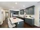 Spacious kitchen featuring a large island with seating, modern stainless appliances, and beautiful countertops at 1172 Dawn Dr, Charleston, SC 29412