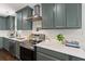 A well-equipped kitchen includes stainless steel appliances, custom cabinets, and ample counter space at 1172 Dawn Dr, Charleston, SC 29412