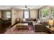 Inviting living room with a spacious sectional, hardwood floors, and a view into the adjacent dining area at 1172 Dawn Dr, Charleston, SC 29412
