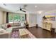 Cozy living room with a comfortable sectional sofa, hardwood floors, and ample natural light at 1172 Dawn Dr, Charleston, SC 29412
