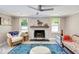 Inviting living room featuring a fireplace, two comfy sofas, a ceiling fan and lots of natural light at 1172 Dawn Dr, Charleston, SC 29412
