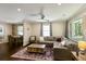 Comfortable living room featuring a sectional sofa, hardwood floors, and a stylish rug, creating a welcoming atmosphere at 1172 Dawn Dr, Charleston, SC 29412