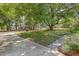 Spacious yard featuring mature trees, lush greenery, and a well-maintained lawn, perfect for outdoor enjoyment at 1172 Dawn Dr, Charleston, SC 29412