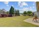 Spacious backyard featuring a lush lawn and a tranquil water feature at 118 Billowing Sails St, Summerville, SC 29486