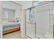 Bathroom with glass-enclosed shower with a glimpse into the bedroom at 118 Billowing Sails St, Summerville, SC 29486