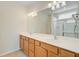 Bright bathroom features a double sink vanity with ample storage, modern lighting, and a large mirror at 118 Billowing Sails St, Summerville, SC 29486