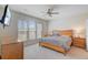 Serene bedroom with a large window, ceiling fan and ample closet space at 118 Billowing Sails St, Summerville, SC 29486