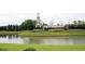 Beautiful entrance to the Del Webb at Cane Bay community featuring lush landscaping and signage at 118 Billowing Sails St, Summerville, SC 29486