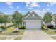Charming home featuring a two-car garage, well-maintained landscaping, and inviting curb appeal at 118 Billowing Sails St, Summerville, SC 29486