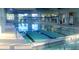 Bright indoor pool with lane markers, ample natural light, and access to fitness equipment at 118 Billowing Sails St, Summerville, SC 29486