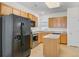 Modern kitchen with island, stainless steel appliances, and plenty of cabinet space at 118 Billowing Sails St, Summerville, SC 29486