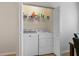 Convenient laundry closet with washer, dryer and shelving at 118 Billowing Sails St, Summerville, SC 29486