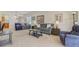 Spacious living room with neutral tones, plush seating, and abundant natural light at 118 Billowing Sails St, Summerville, SC 29486