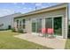 Back patio with seating and sliding glass door at 118 Billowing Sails St, Summerville, SC 29486
