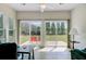 Bright sunroom with tile flooring, large windows, and view to the backyard at 118 Billowing Sails St, Summerville, SC 29486
