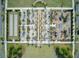 Bird's-eye view of an amenity center featuring a playground, seating area, and bocce ball courts at 1226 Spotflower St, Summerville, SC 29485