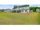 Spacious backyard featuring a well-maintained lawn and a view of the home's exterior at 1226 Spotflower St, Summerville, SC 29485
