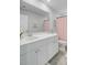 Bright bathroom featuring a white vanity with a large mirror, a stylish shower curtain, and modern fixtures at 1226 Spotflower St, Summerville, SC 29485