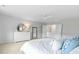 Bright bedroom features a dresser, mirrors, fan and open doorway at 1226 Spotflower St, Summerville, SC 29485
