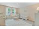 Charming Bedroom with crib, rocker, and soft pastel colors at 1226 Spotflower St, Summerville, SC 29485