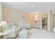 Charming Bedroom with white furniture, including a crib, chair, and bookshelf, creating a cozy and inviting space at 1226 Spotflower St, Summerville, SC 29485