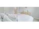 Bright bedroom featuring white linens, blue accents and neutral decor at 1226 Spotflower St, Summerville, SC 29485