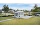 Charming sunroom with large windows and blue exterior, surrounded by well-maintained landscaping at 1226 Spotflower St, Summerville, SC 29485