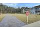 Community park with new construction homes, soccer field, and walking path surrounded by lush trees at 1226 Spotflower St, Summerville, SC 29485