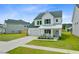 Attractive two-story home with a green roof, a two-car garage, and landscaped front yard at 1226 Spotflower St, Summerville, SC 29485