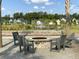 Gather around the outdoor brick fire pit on a gravel ground with comfortable seating for relaxation at 1226 Spotflower St, Summerville, SC 29485